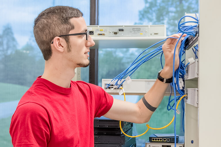 a man working on some wires